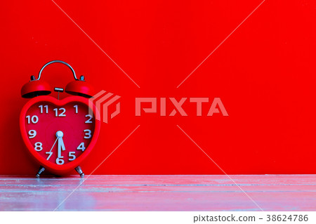 red alarm clock 38624786