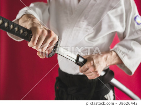 The young man are training Aikido at studio 38626442