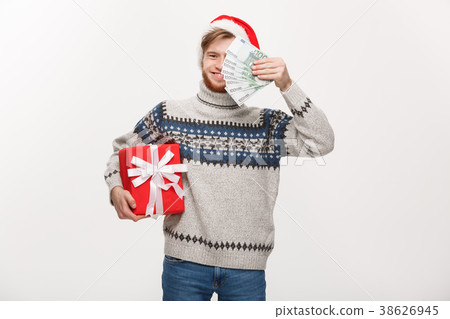 Holiday Concept - young beard man holding a 38626945