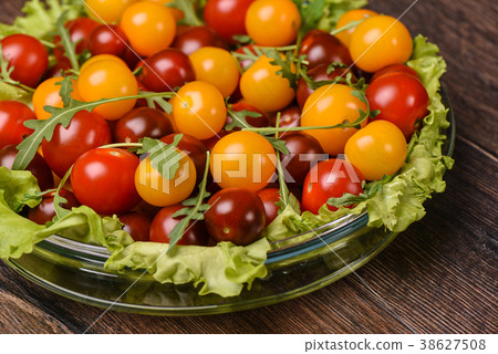Cherry tomatoes in a glass plate close up Cherry tomatoes in a glass plate close up 38627508