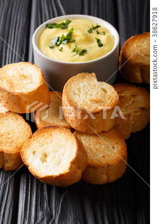Easy appetizer crostini and cheese sauce close-up Easy appetizer crostini and cheese sauce close-up 38627918