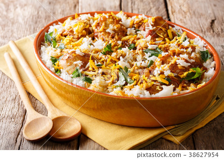 Chicken biryani with spicy spices, orange peel Chicken biryani with spicy spices, orange peel 38627954