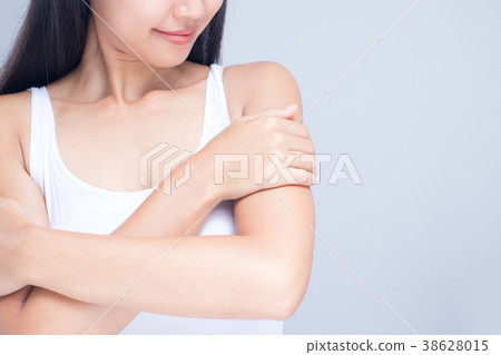 A woman is applying lotion. A woman is applying lotion. 38628015