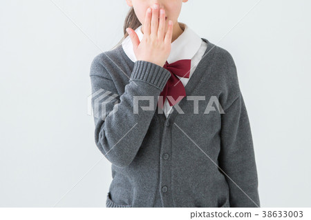 Girl in uniform holding mouth 38633003