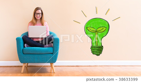 Eco Light Bulb with young woman using her laptop Eco Light Bulb with young woman using her laptop 38633399