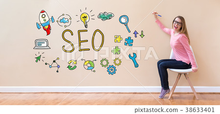 SEO with young woman holding a pen SEO with young woman holding a pen 38633401