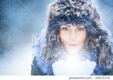 Beautiful smiling young woman in warm clothing. Beautiful smiling young woman in warm clothing. 38635535
