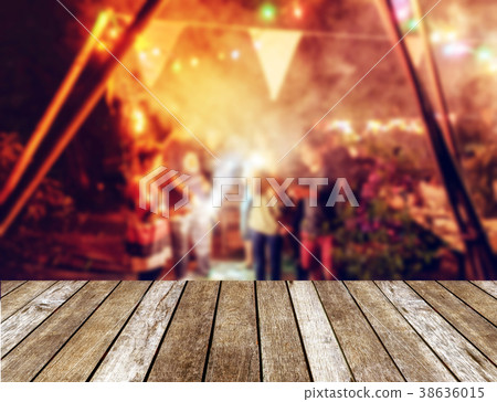 Wooden table top on blurred new year celebration Wooden table top on blurred new year celebration 38636015