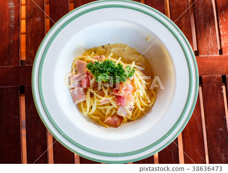 Spaghetti Carbonara with bacon, ham and vegetable 38636473