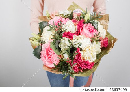 Florist at work. Make rich bouquet diferent color Florist at work. Make rich bouquet diferent color 38637499