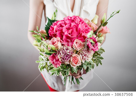 beautiful luxury bouquet of mixed flowers in woman 38637508