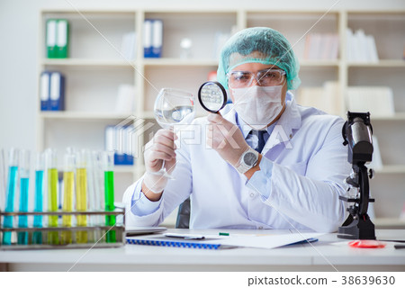 Forensics investigator working in lab on crime 38639630