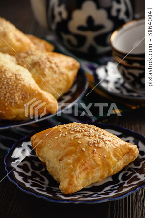 Puff pastries with meat (samosa). Puff pastries with meat (samosa). 38640041