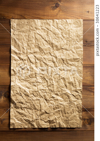 wrinkled paper at wooden plank wrinkled paper at wooden plank 38641223