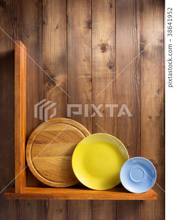plate at kitchen wooden shelf at wall 38641952
