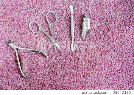 Set of manicure instruments on towel. Nail care Set of manicure instruments on towel. Nail care 38642320