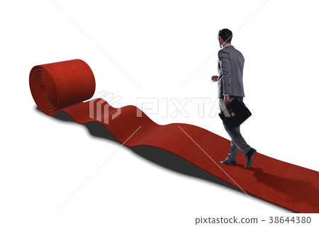 The businessman on red carpet isolated white 38644380
