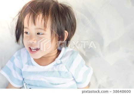 Happy little asian girl smiling play with sand 38648600