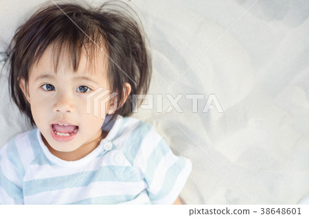 Happy little asian girl play with sand 38648601