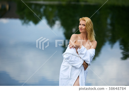 beautiful young woman in shirt by lake beautiful young woman in shirt by lake 38648784