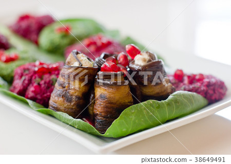 Rolls of eggplant with a filling of walnuts 38649491