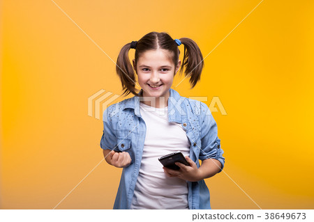 Happy kid holding a smartphone in hands Happy kid holding a smartphone in hands 38649673