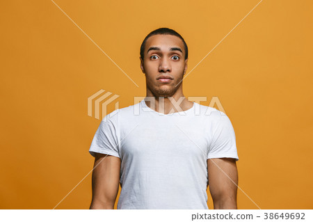 The young attractive man looking suprised isolated The young attractive man looking suprised isolated 38649692