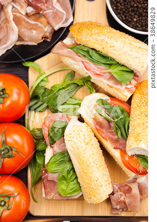 Close up on healthy sandwiches lying on wooden Close up on healthy sandwiches lying on wooden 38649829
