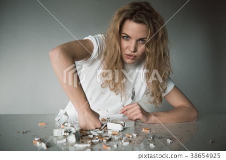 Willful young woman against smoking Willful young woman against smoking 38654925