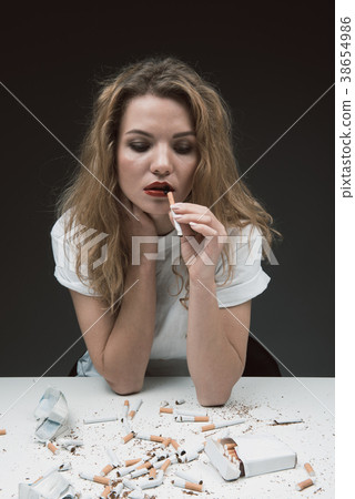 Sad lady with smoke addiction Sad lady with smoke addiction 38654986