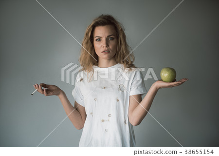 Severe female person choosing lifestyle Severe female person choosing lifestyle 38655154
