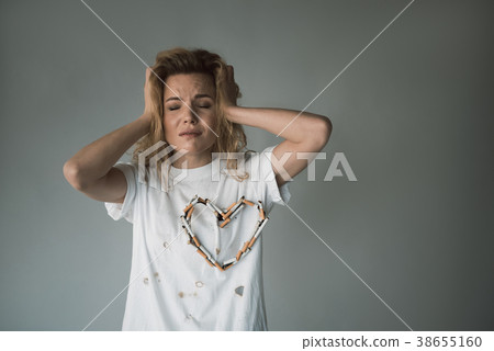 Stressed female smoker being unhealthy 38655160