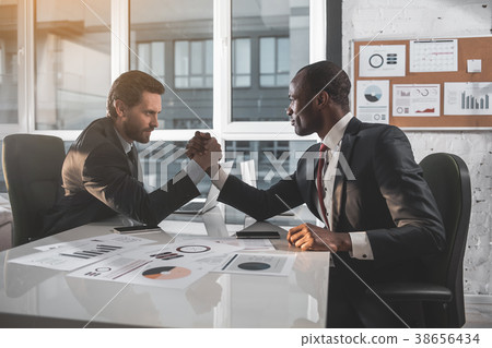 Young managers are competing in office 38656434