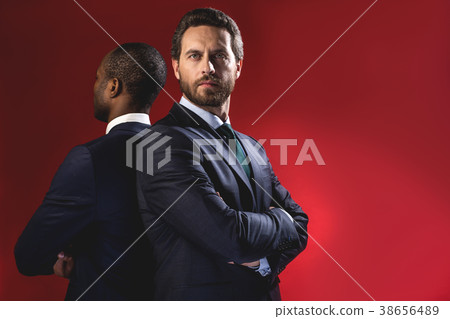 Determined businessmen are expressing assurance Determined businessmen are expressing assurance 38656489