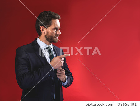 Confident bristled man is gesticulating Confident bristled man is gesticulating 38656491