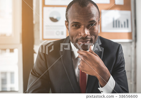 Pensive young manager is posing in office Pensive young manager is posing in office 38656600
