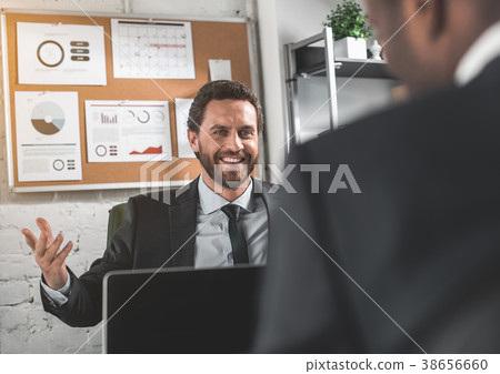 Two entrepreneurs are discussing with smile Two entrepreneurs are discussing with smile 38656660