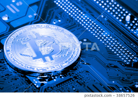 close up of Golden Bitcoin money on computer. close up of Golden Bitcoin money on computer. 38657526