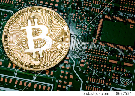 close up of Golden Bitcoin money on computer. 38657534