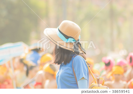 Teachers stand watching students play sports. 38659541