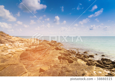 Rocky beach over seacoast skyline Rocky beach over seacoast skyline 38660315
