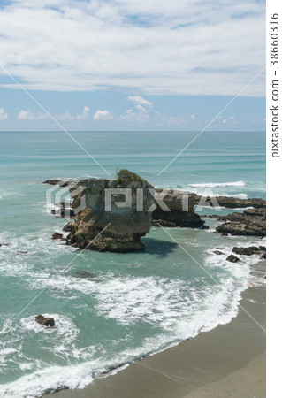 Pancake rock on sand beach Pancake rock on sand beach 38660316