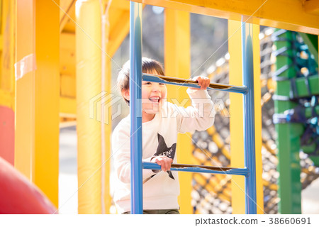 A boy playing in a park A boy playing in a park 38660691