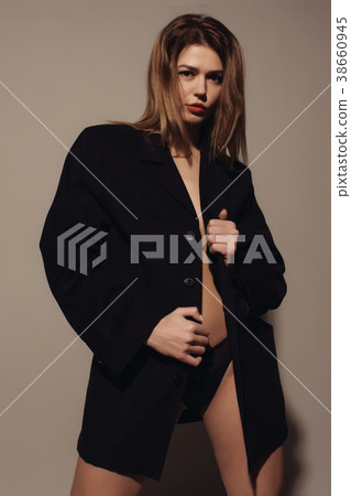 young attractive woman posing in a jacket young attractive woman posing in a jacket 38660945