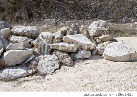 Pile of big white limestones. 38661423