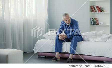 Senior lonely person sitting on couch and thinking 38662898