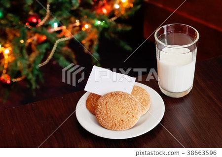 Christmas cookies and milk with note for Santa Christmas cookies and milk with note for Santa 38663596