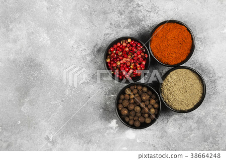 Various pepper on a gray background. Top view Various pepper on a gray background. Top view 38664248