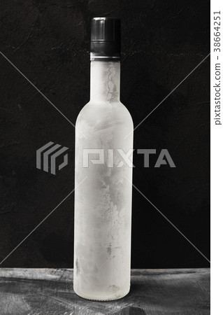 Cold vodka in shot glasses on a black background 38664251