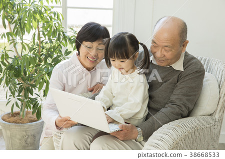 Senior couple and grandchild Senior couple and grandchild 38668533